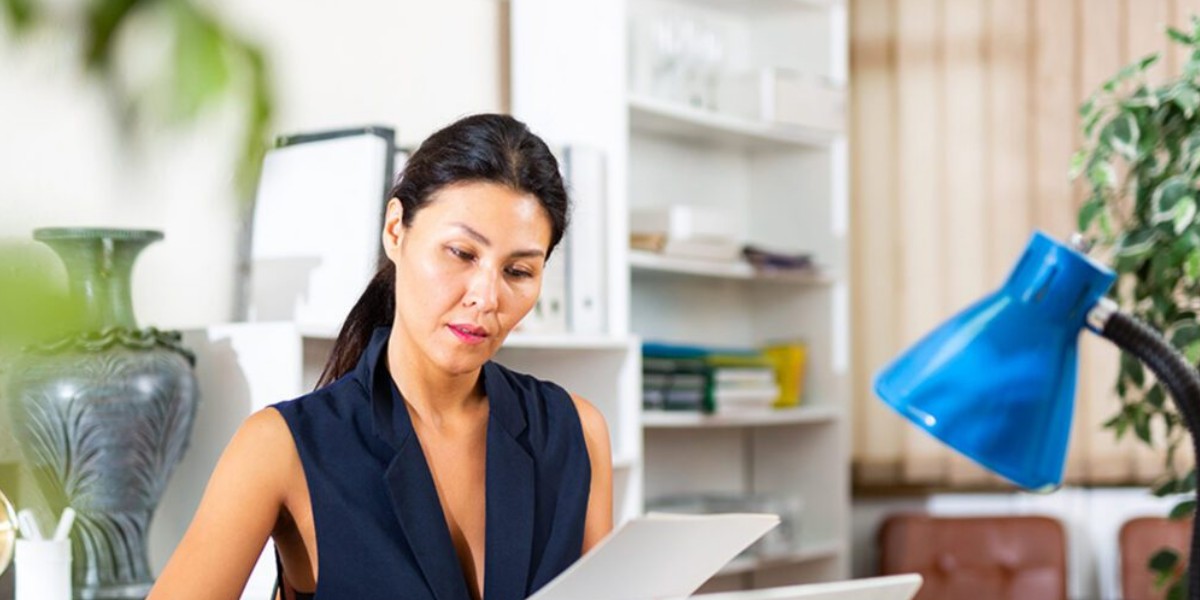 woman looking at paperwork
